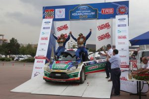 KOCAELI, TURKEY - AUGUST 23, 2015: Murat Bostanci with Ford Fiesta S2000 of Castrol Ford Team Turkiye in Podium Ceremony of Kocaeli Rally 2015