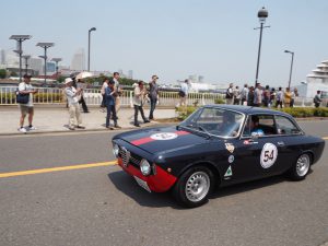 Yokohama, Japan - May 21, 2016: ALFA ROMEO GIULIA SPRINT GTV 1966 drive down a road of the 2016 Rally Yokohama in Japan.